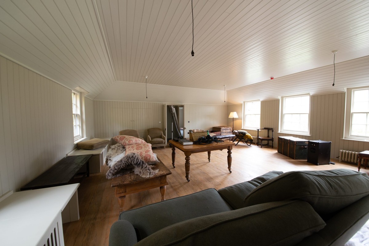 Panelled living room whose woodwork hides a Mobius 5i speaker