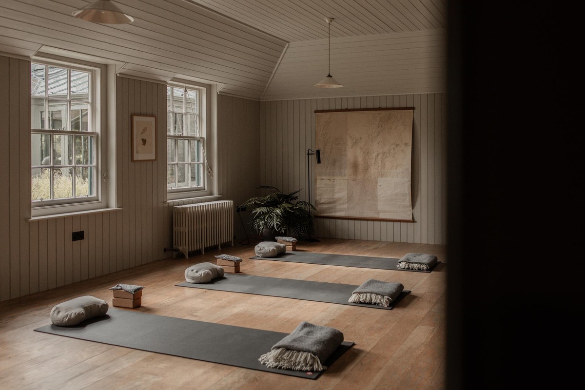 Panelled yoga room, speaker hidden behind the woodwork