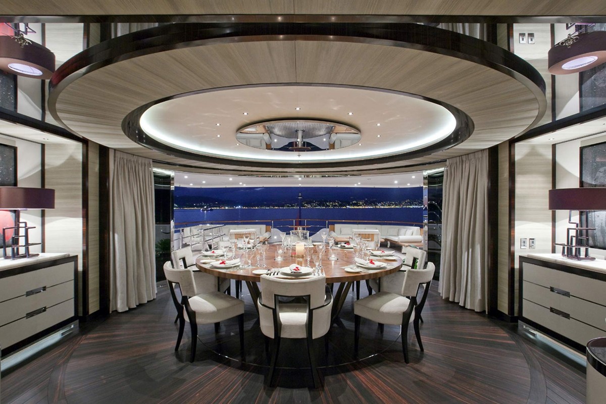 Round dining room under a lit ceiling