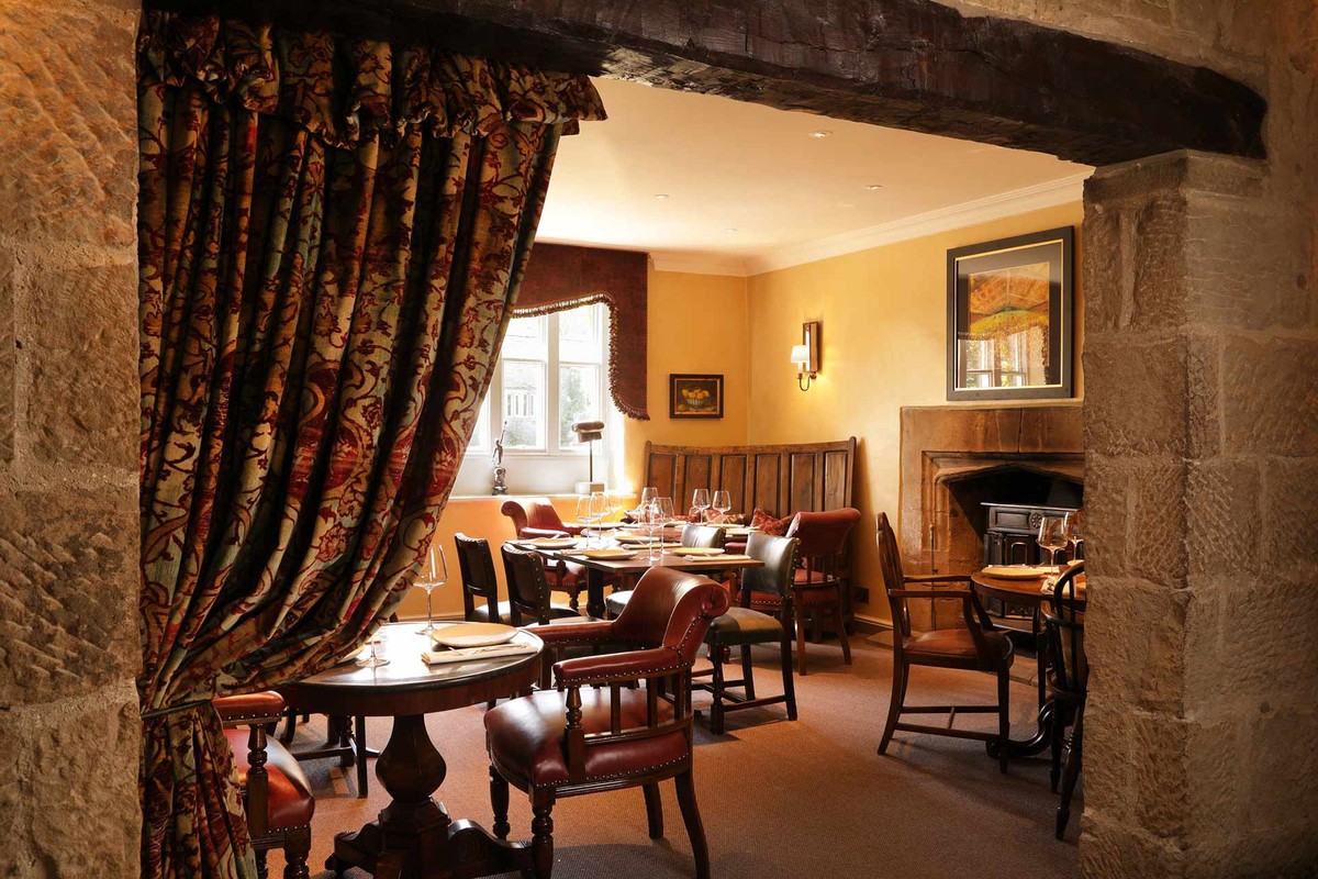 Small dining room with beams and exposed stone
