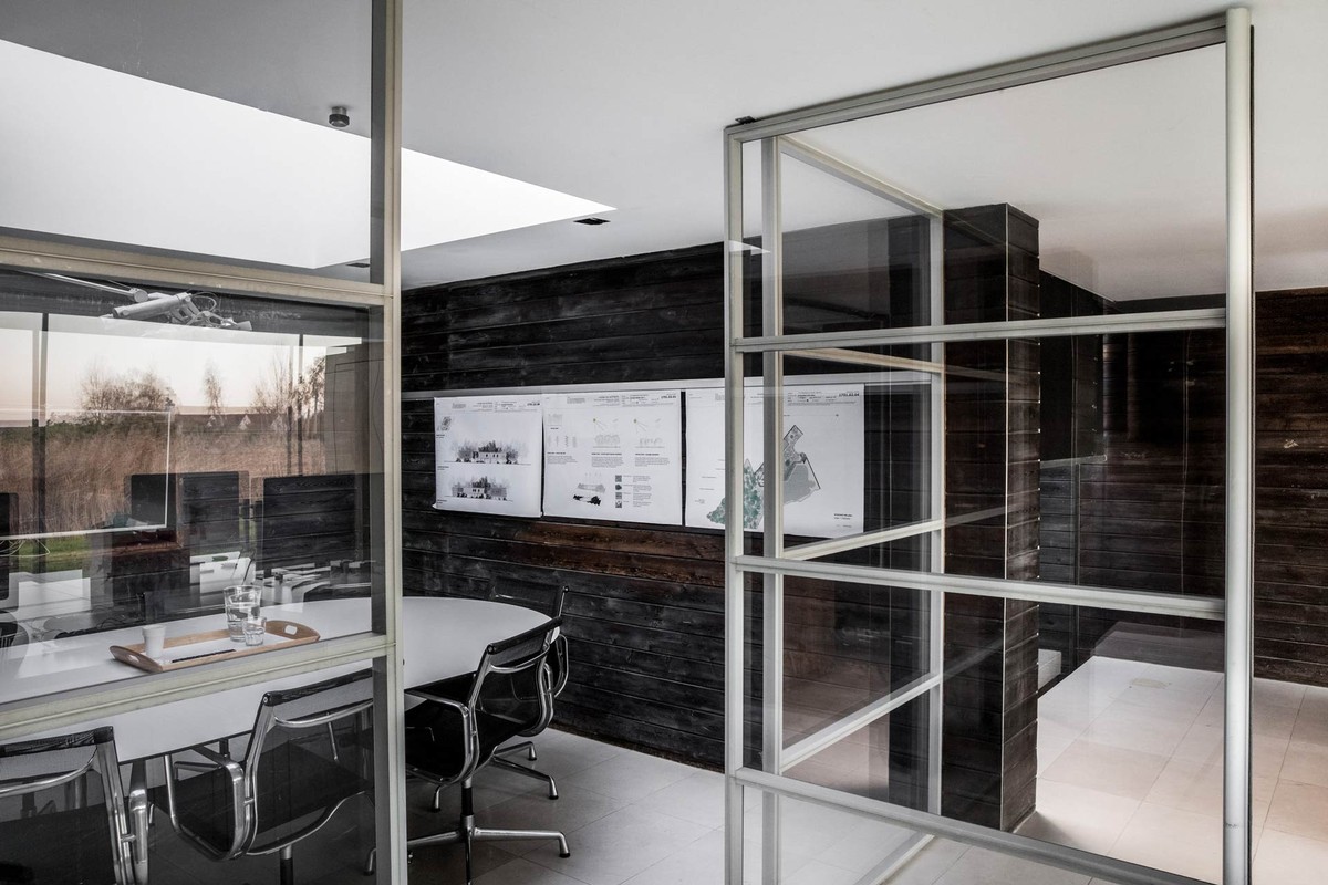 Glazed meeting room with a round table