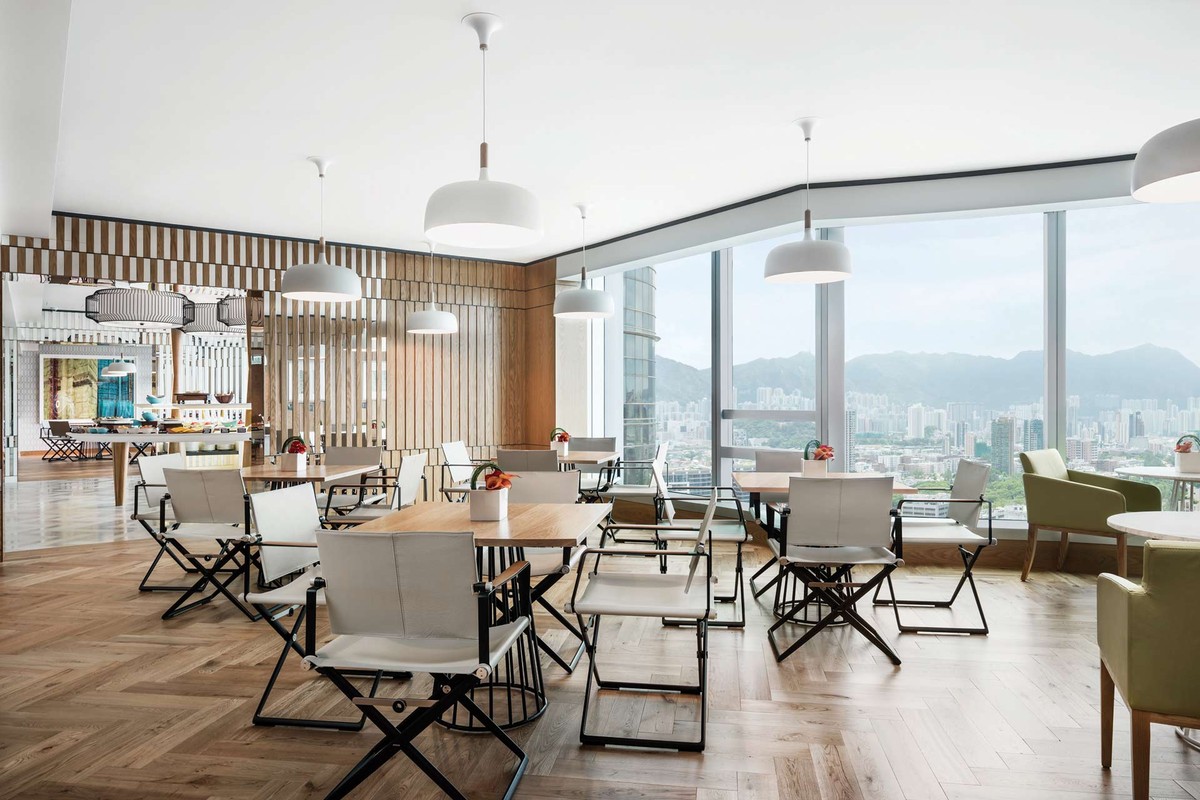 Club lounge dining room with full-height windows