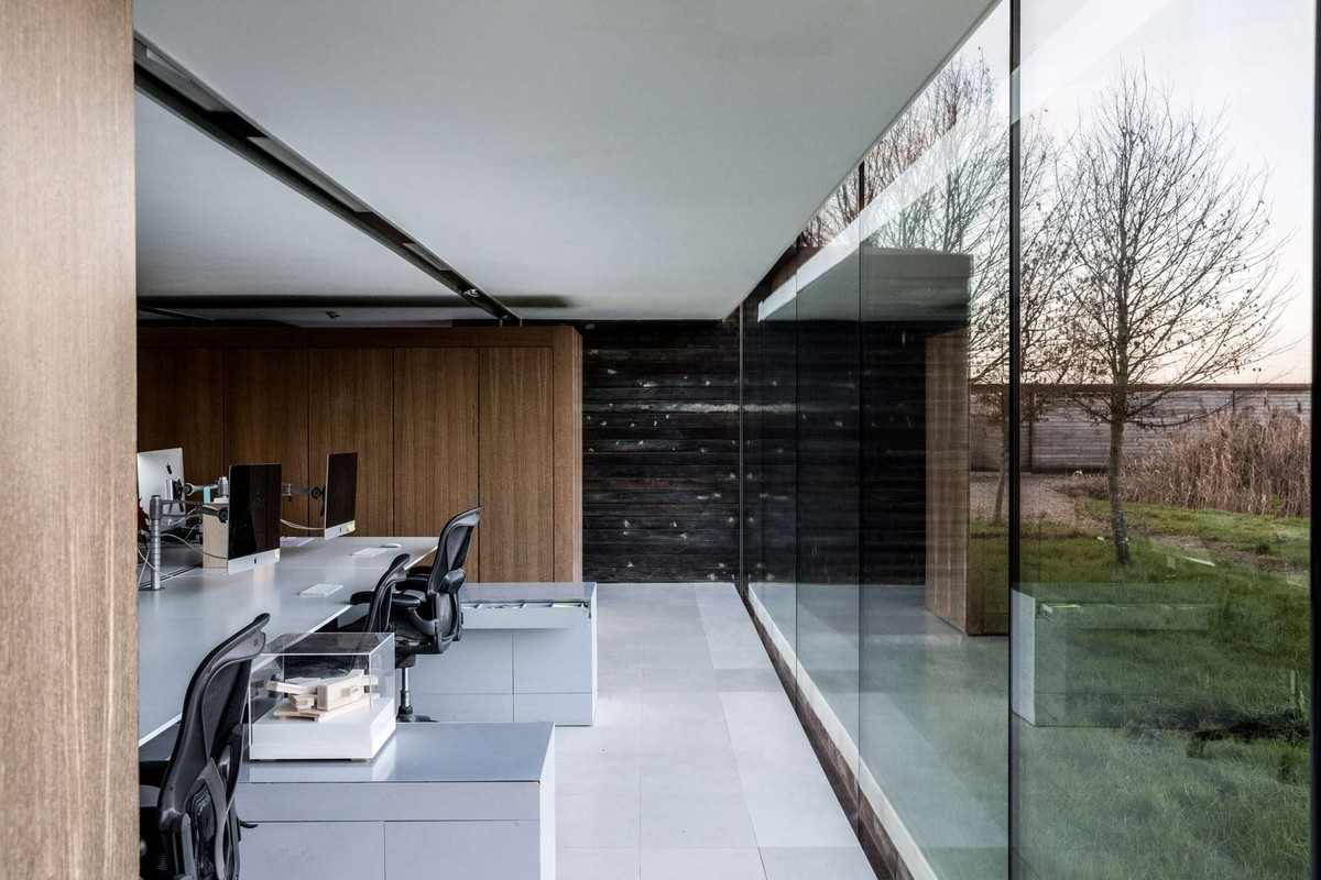 Timber-clad office with a glass partition