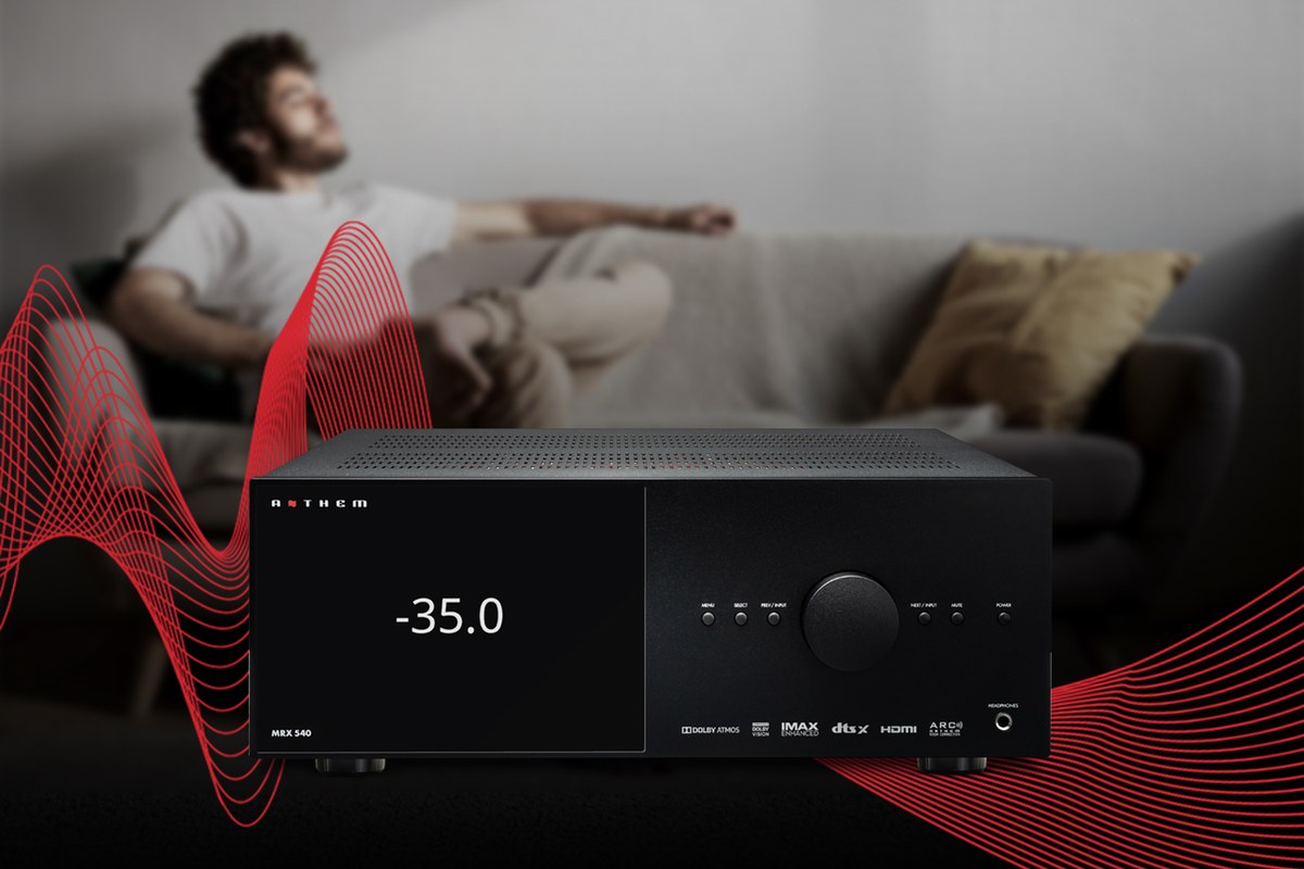 Listener stretched out on a sofa in front of an A/V receiver, with stylised red sound waves