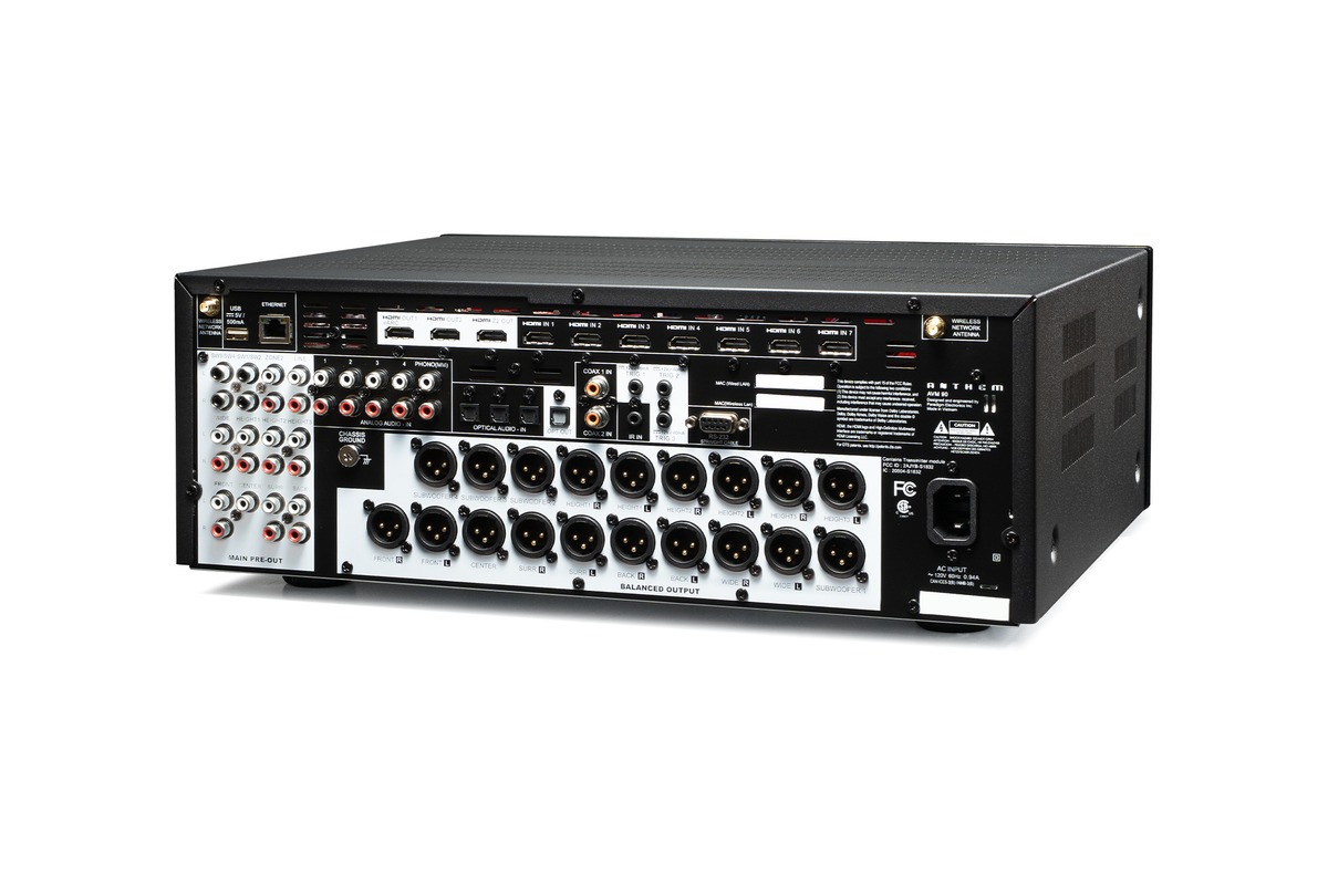 A/V processor seen from the rear three-quarter, with its HDMI inputs, RCA jacks and XLR outputs
