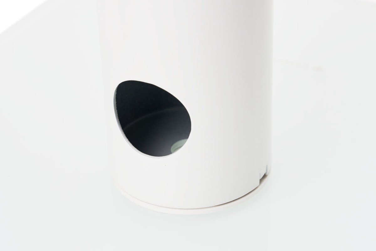White column on its glass base, with the cable outlet