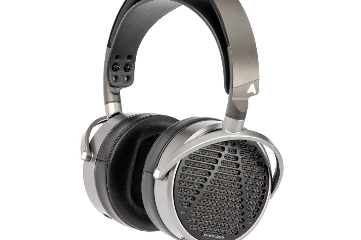 Audeze MM-100 open-back headphones seen from a three-quarter angle, Manny Marroquin earcup