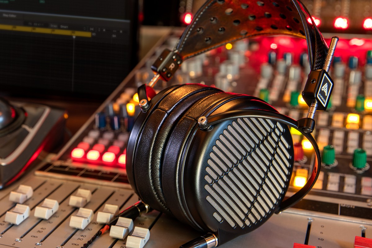 Audeze LCD-MX4 headphone resting on a studio mixing console