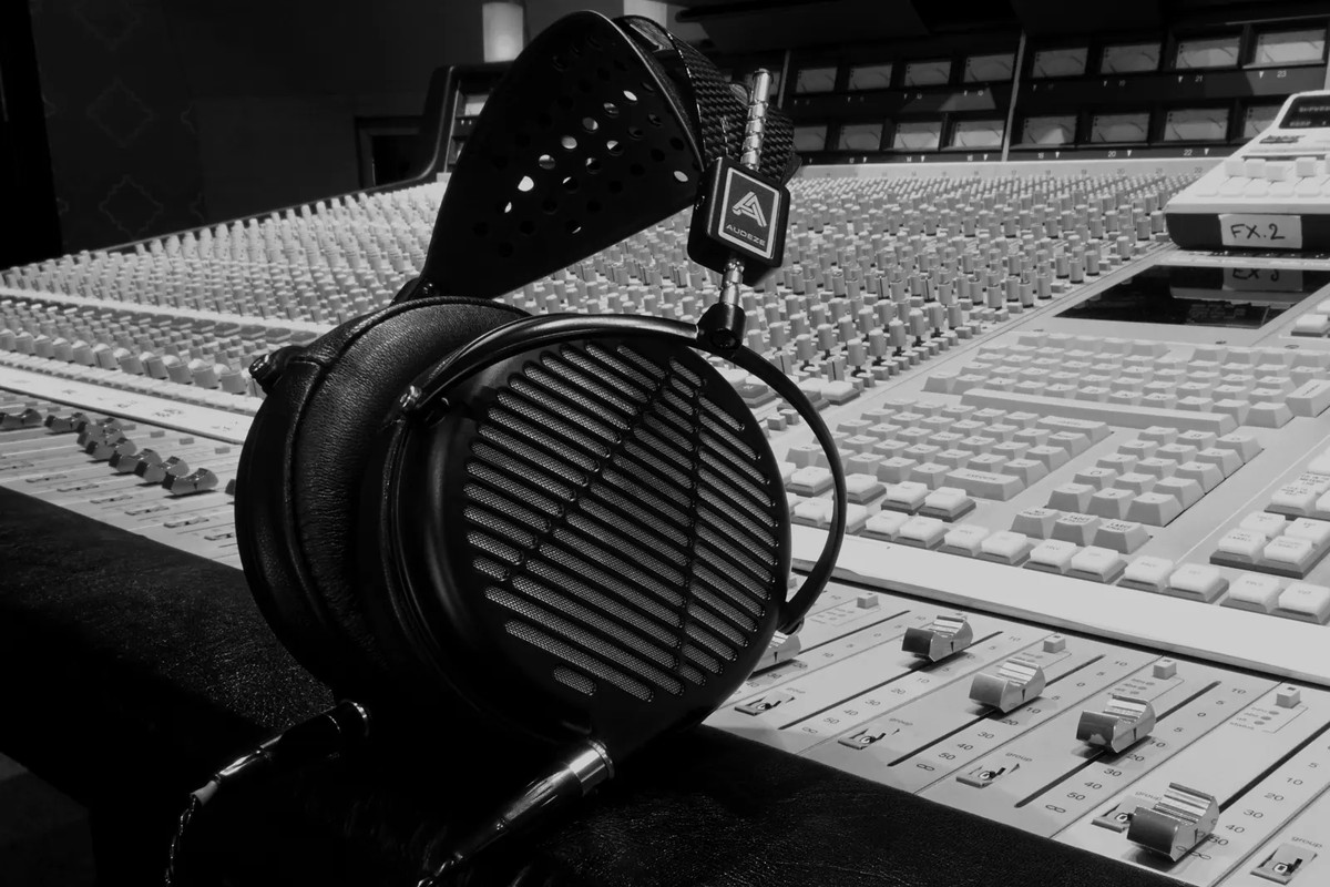 Headphone resting on a mixing console, black-and-white photo