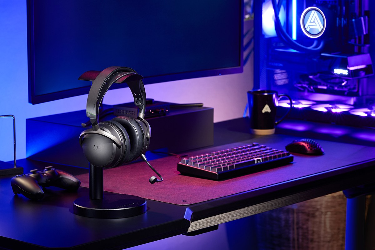 Audeze Maxwell 2 Xbox headset resting on a stand, illuminated gaming desk in the background