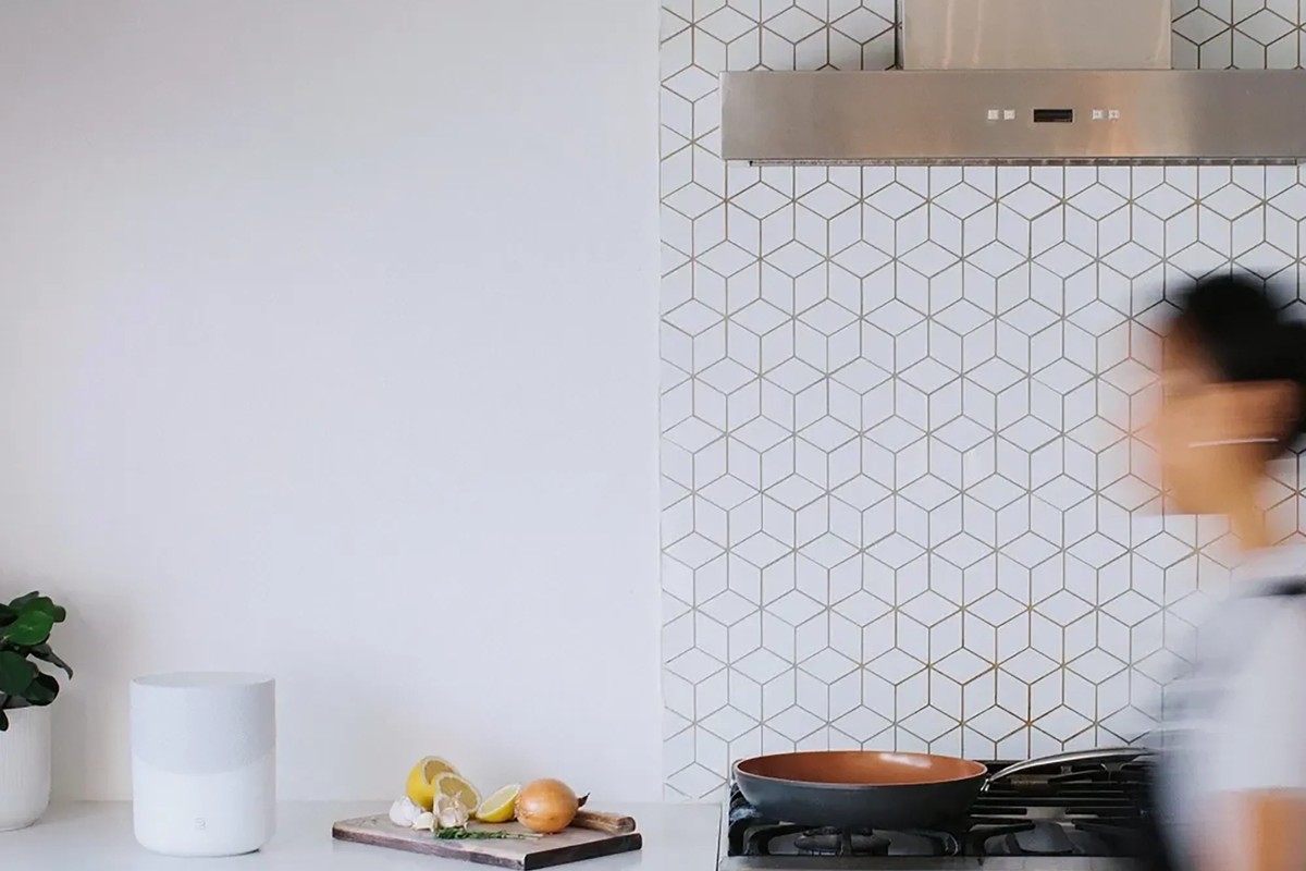 Bright kitchen, white speaker sitting on the worktop