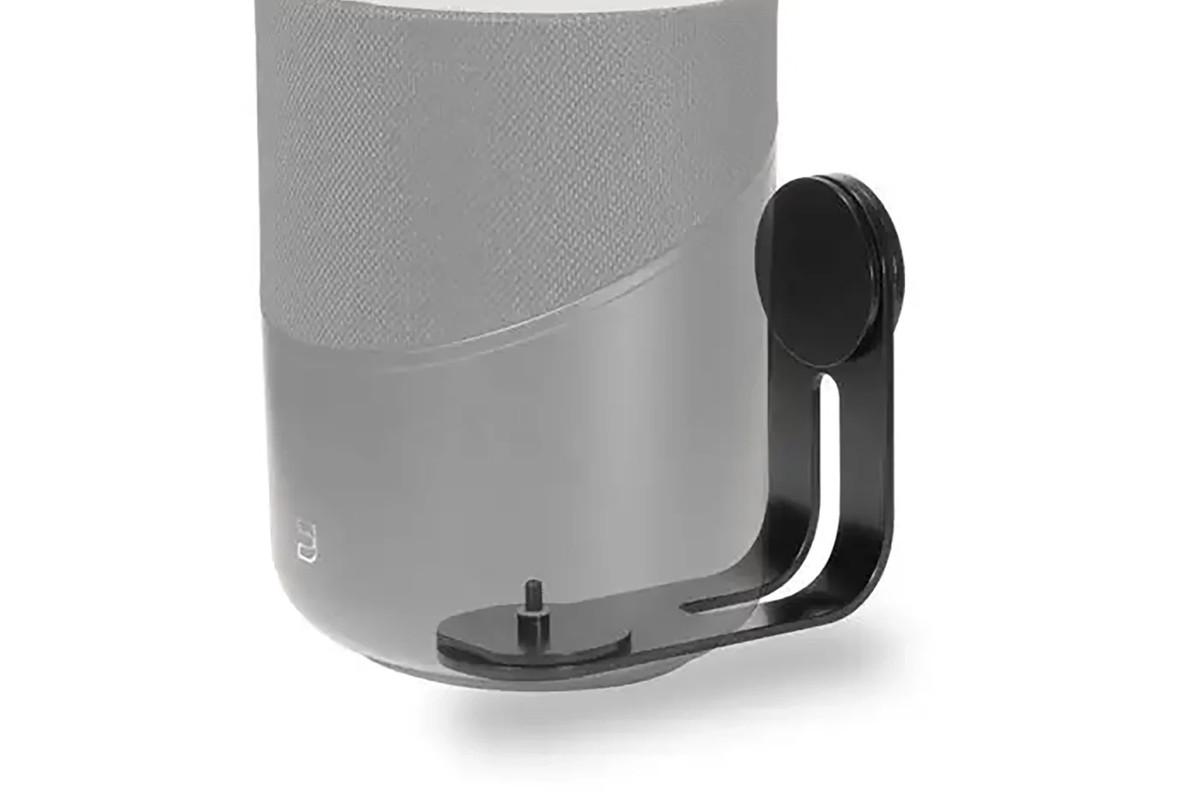 Grey wall bracket holding a cylindrical speaker, front view