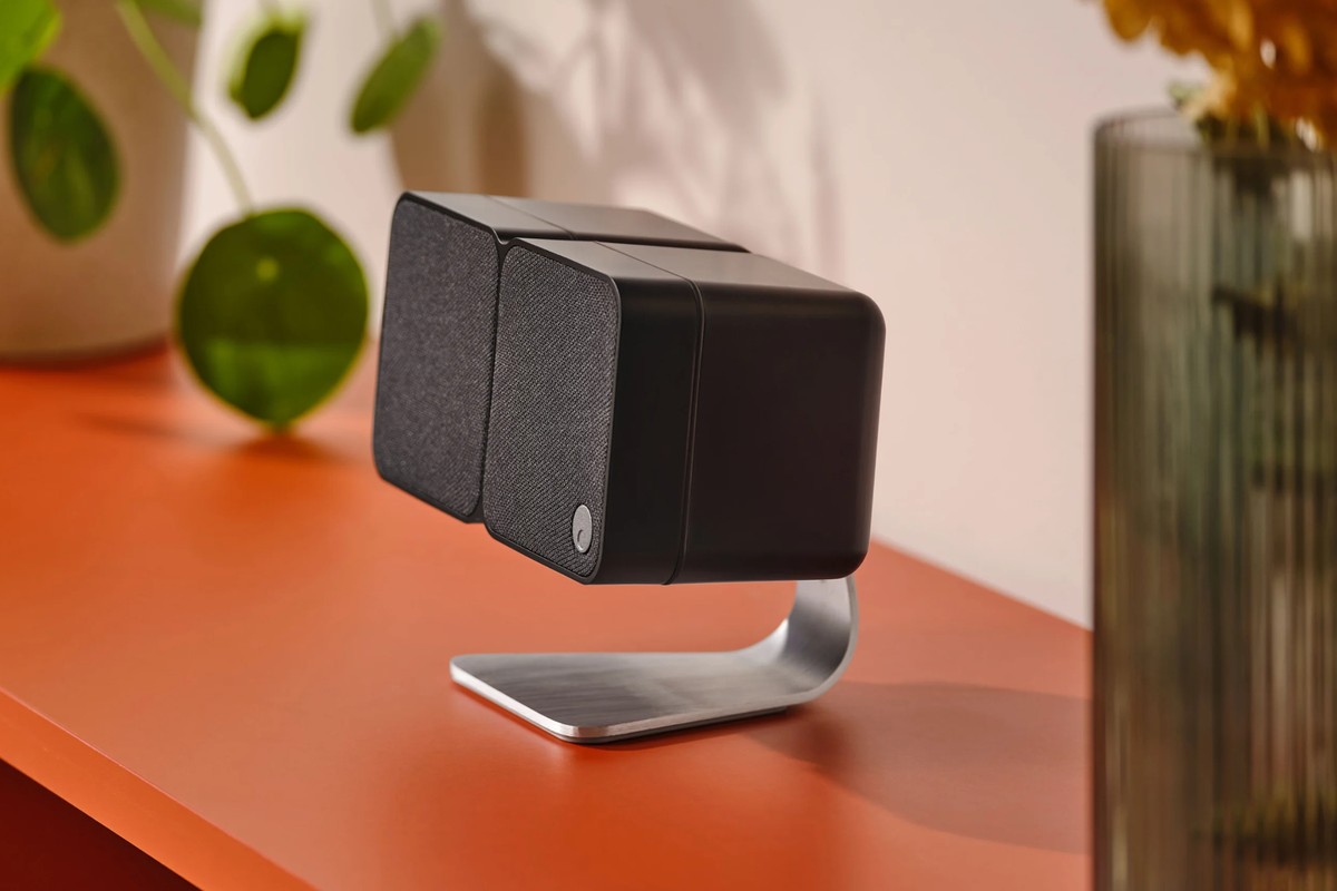 Black Cambridge Audio MSX 20 on its stand on an orange piece of furniture