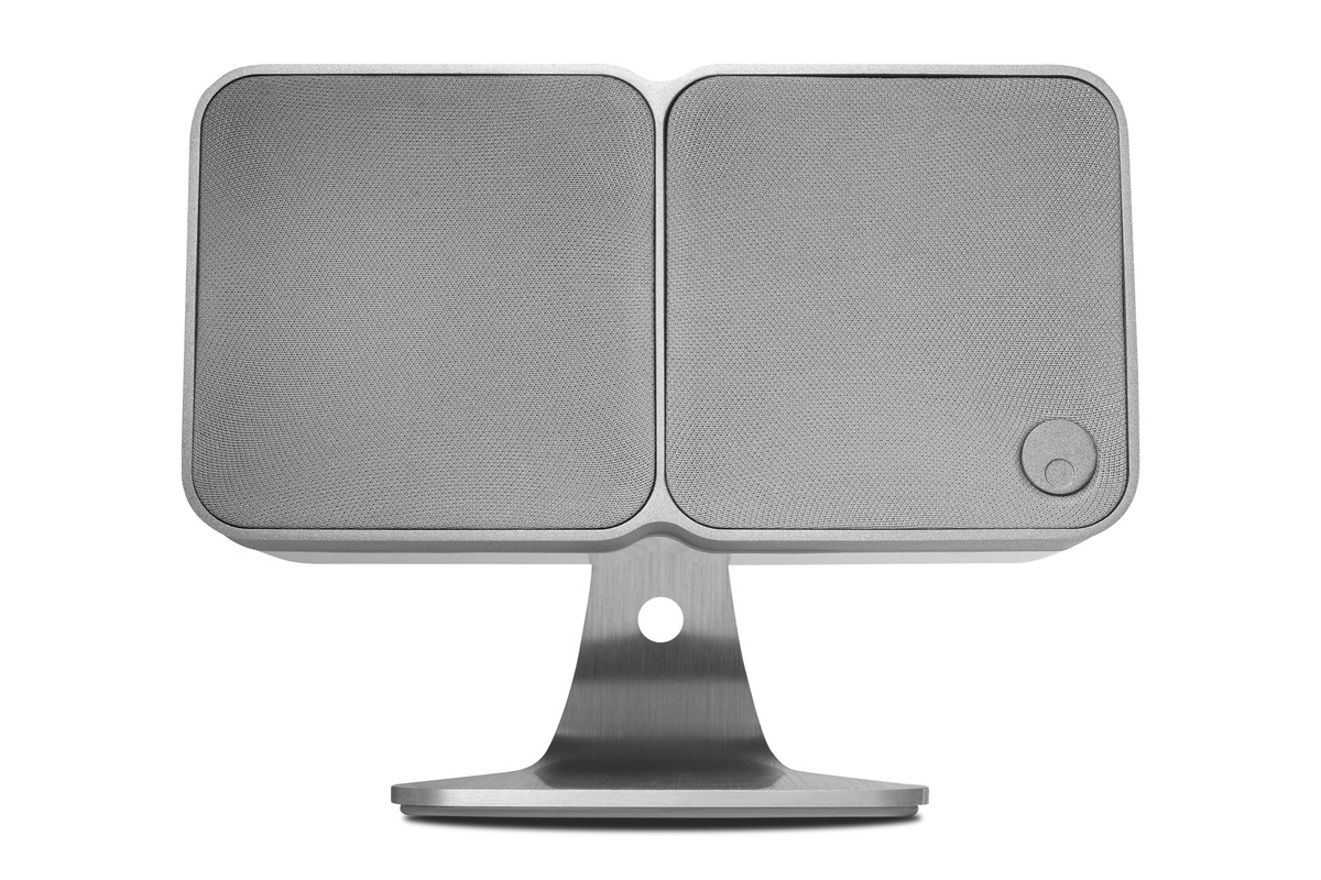 White Cambridge Audio Min 22 speaker lying on a brushed aluminium table stand