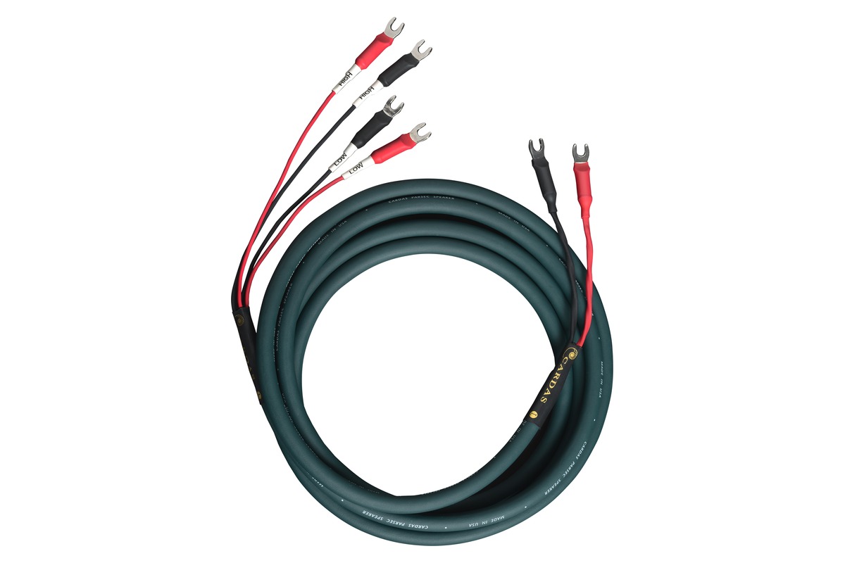 Dark green Cardas Parsec speaker cable coiled, terminated with spade lugs