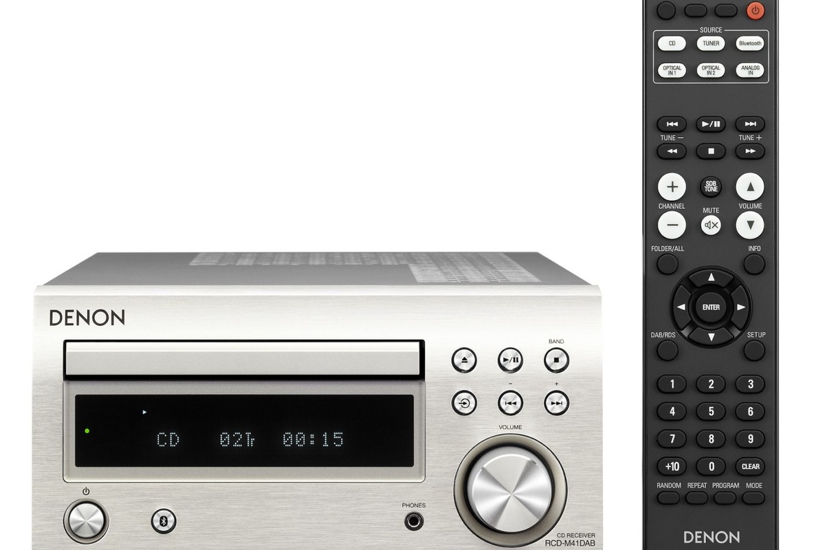 Silver CD receiver from the front, display lit, remote control alongside