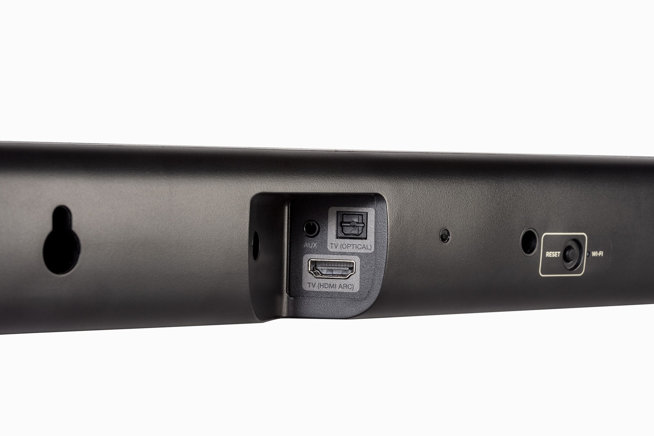 Face arrière d'une barre de son avec prises HDMI ARC et optique, encoche de fixation murale