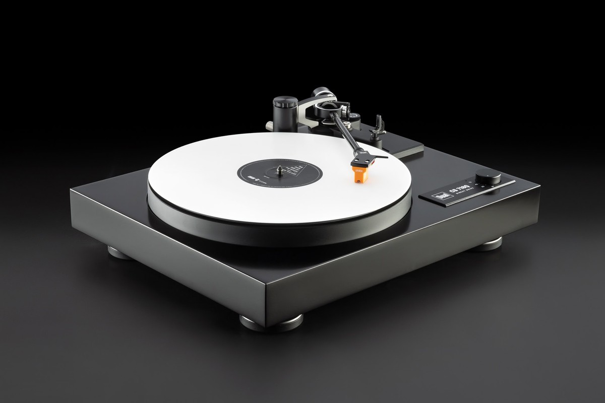 Die-cast aluminium platter and record playing, raised three-quarter view