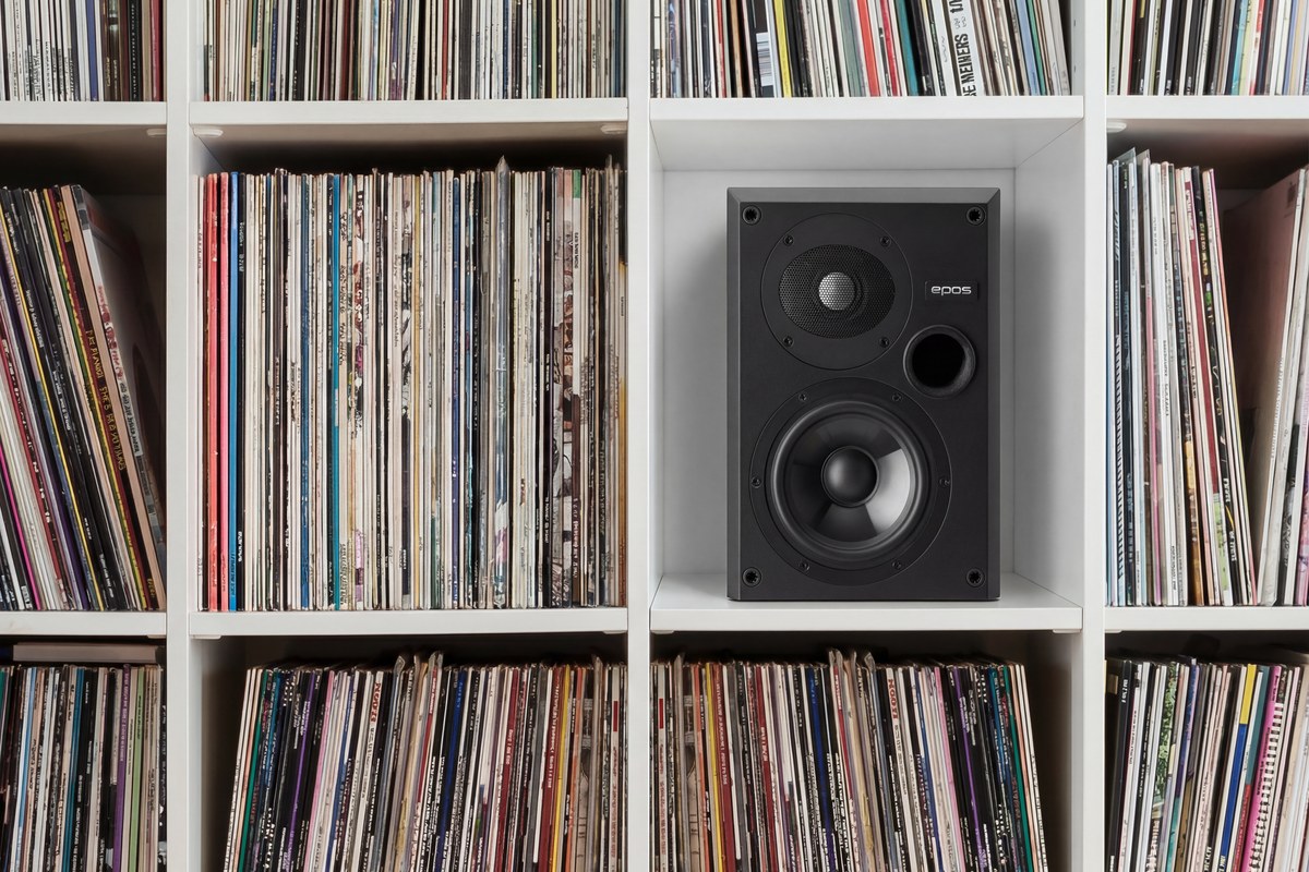 Black loudspeaker fitted into one cube of a vinyl record wall
