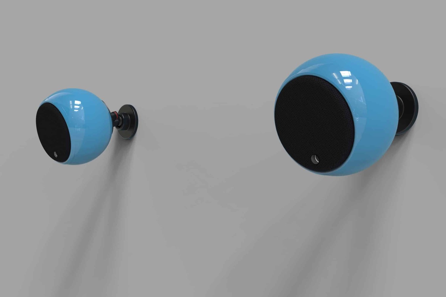 Deux enceintes bleues fixées sur un mur gris