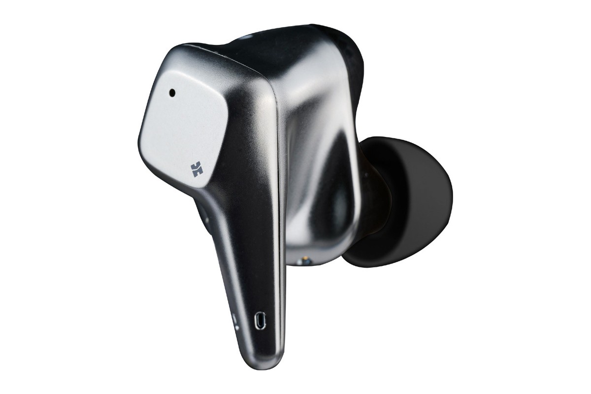 Single silver earbud with its black ear tip