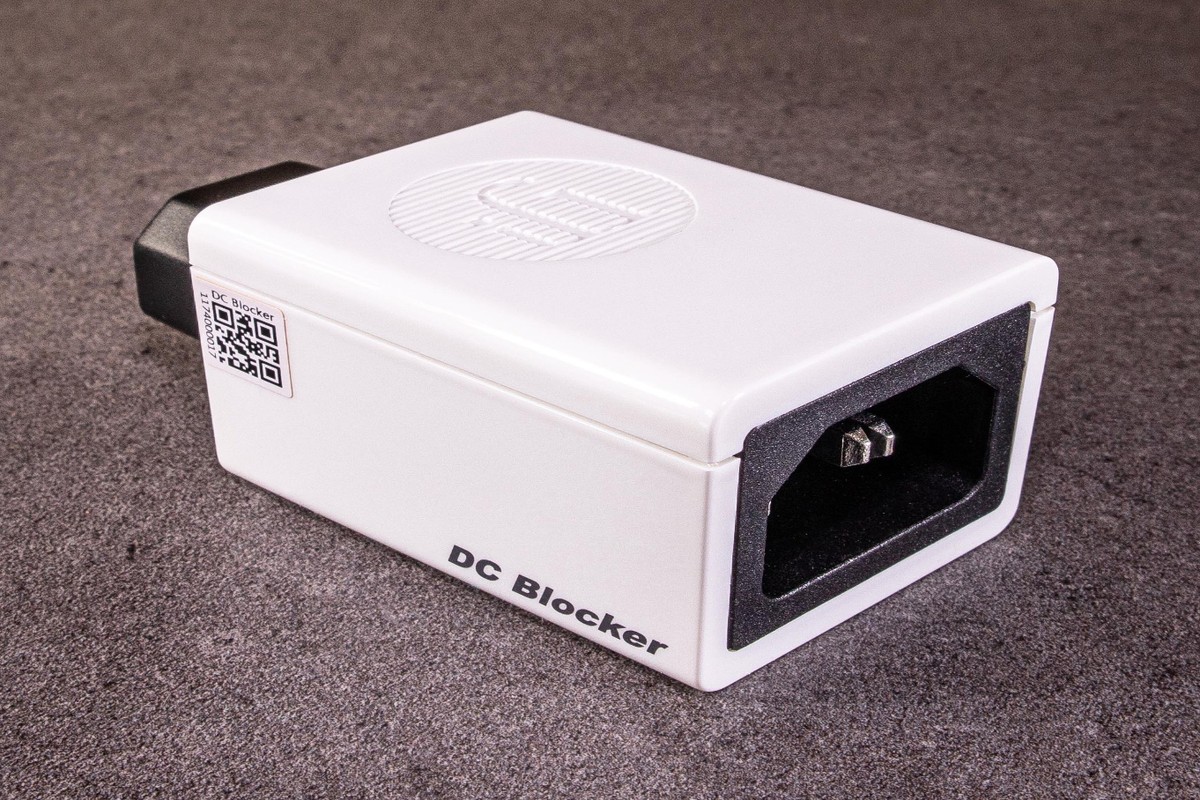 DC Blocker lying on a slate surface, IEC connector visible