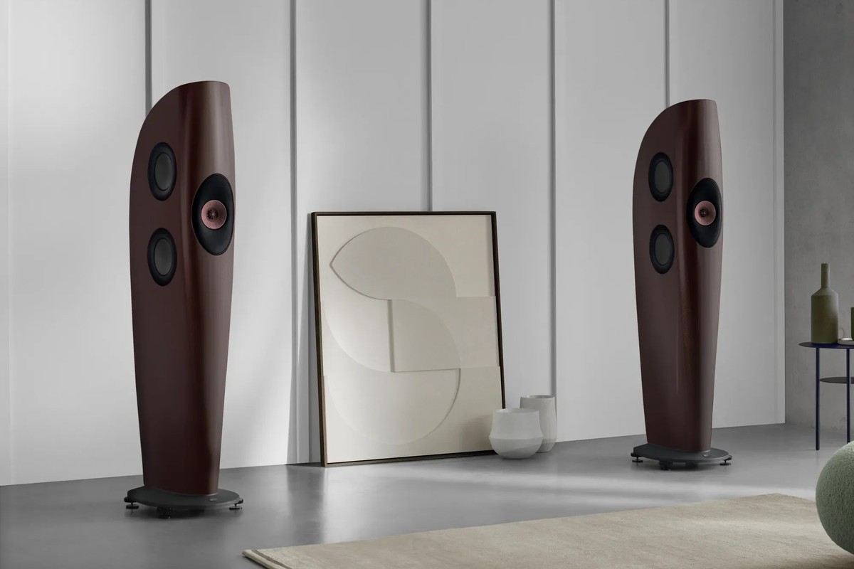 Two garnet red floorstanders against a white wall with vertical panels