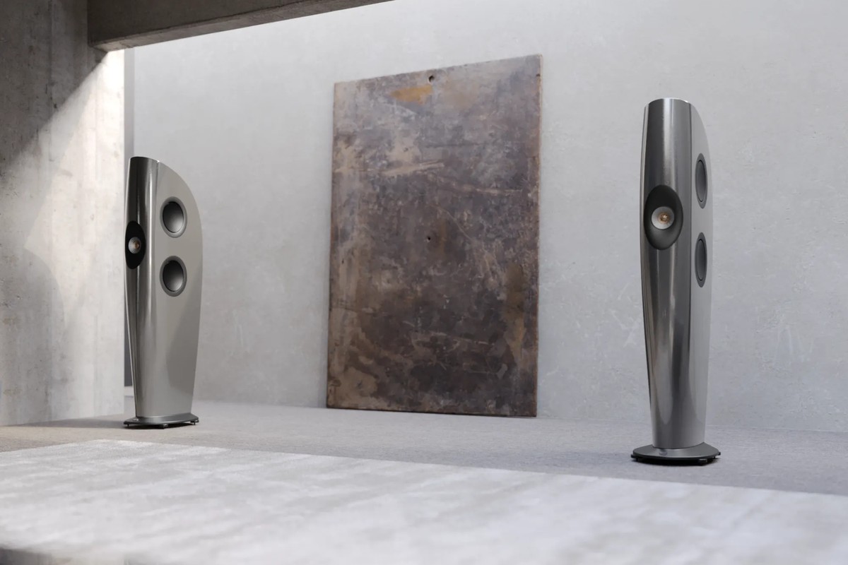 Pair of light grey floorstanders in a bright room with a concrete floor