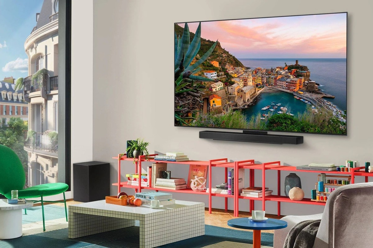 LG OLED evo television wall-mounted in a living room, with a soundbar