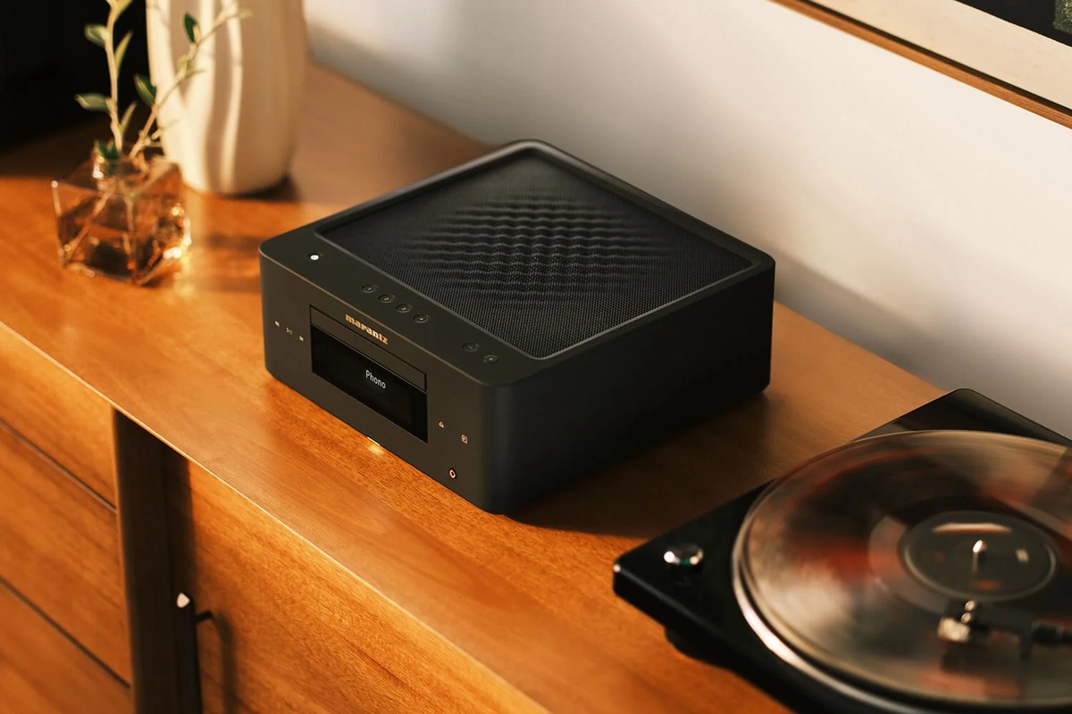 Black finish on a wooden cabinet next to a turntable