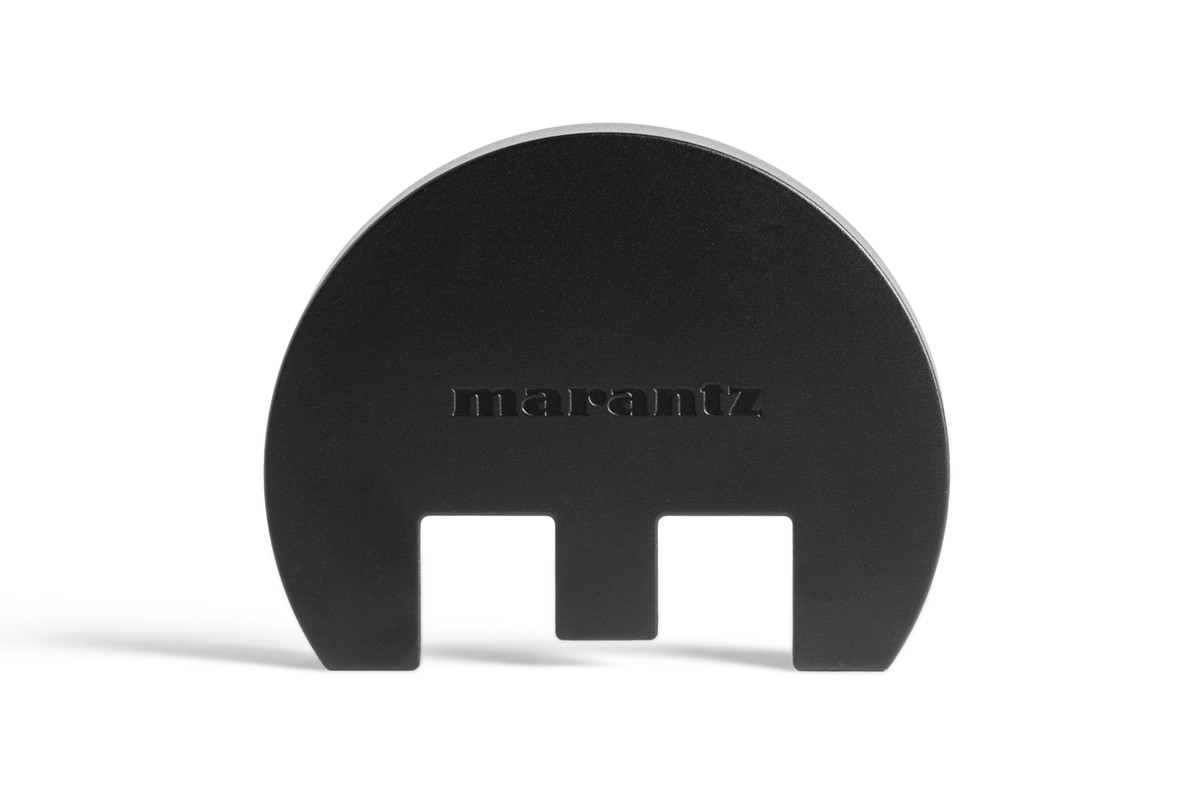 Rounded black plate with an engraved Marantz logo