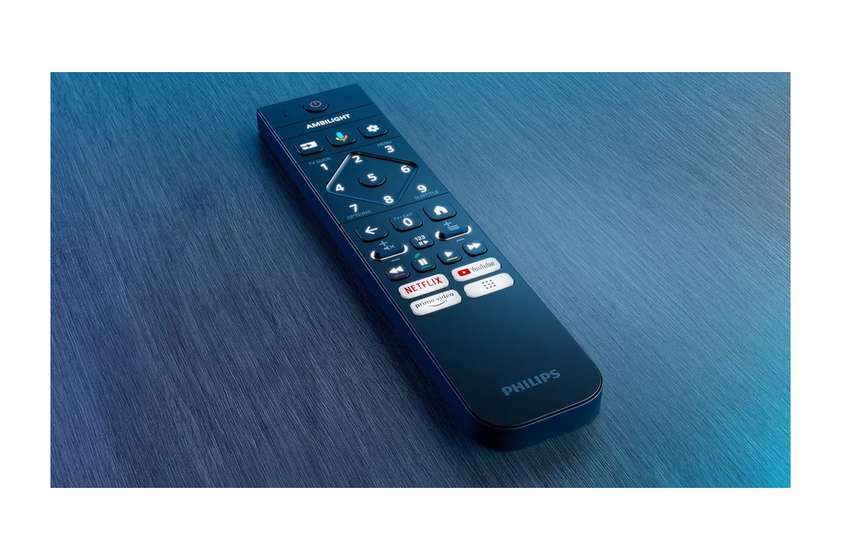 Télécommande Philips posée sur une surface bleue