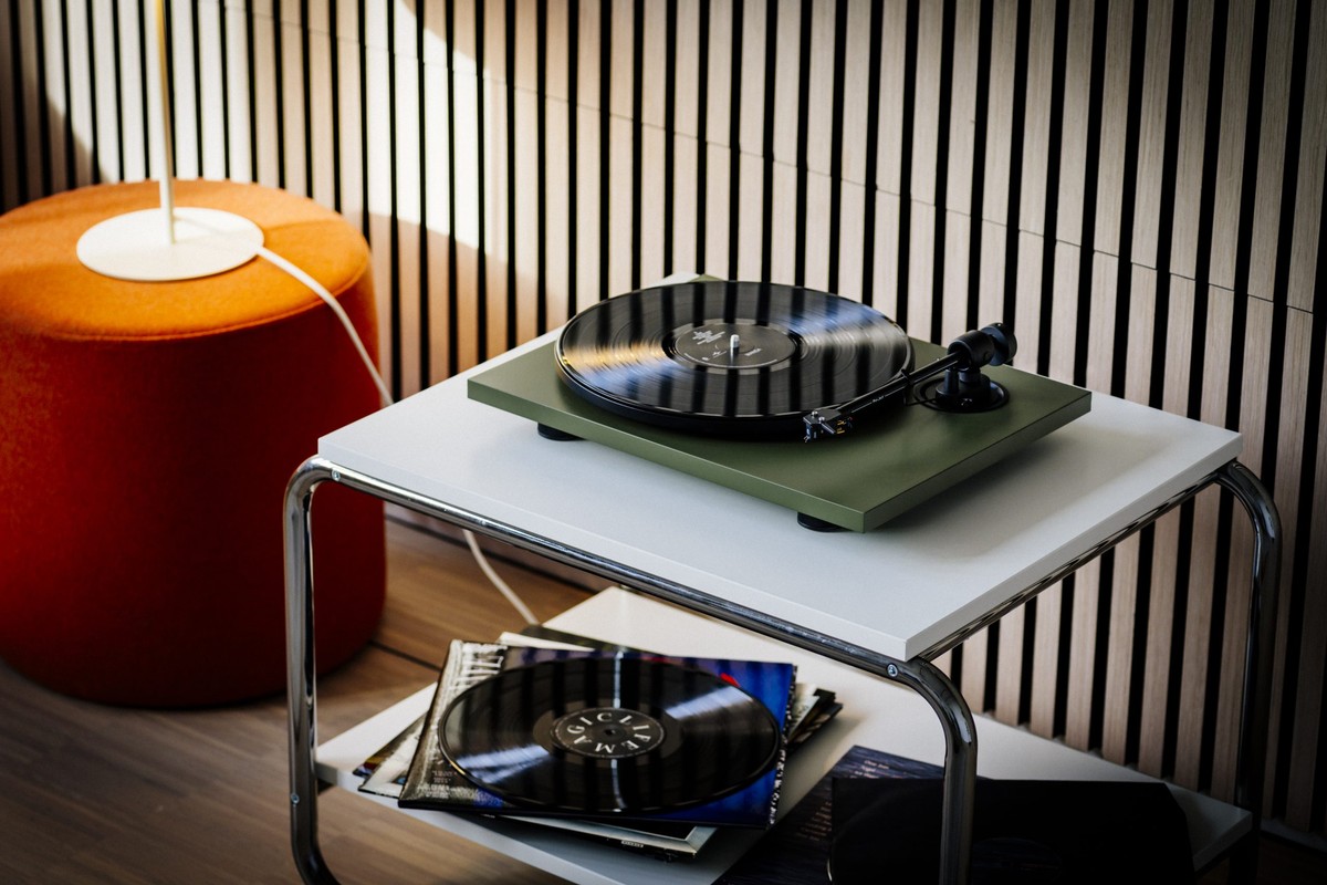 Satin green turntable on a coffee table