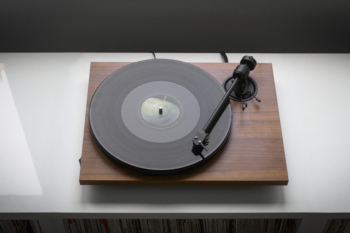 Walnut turntable on a light sideboard
