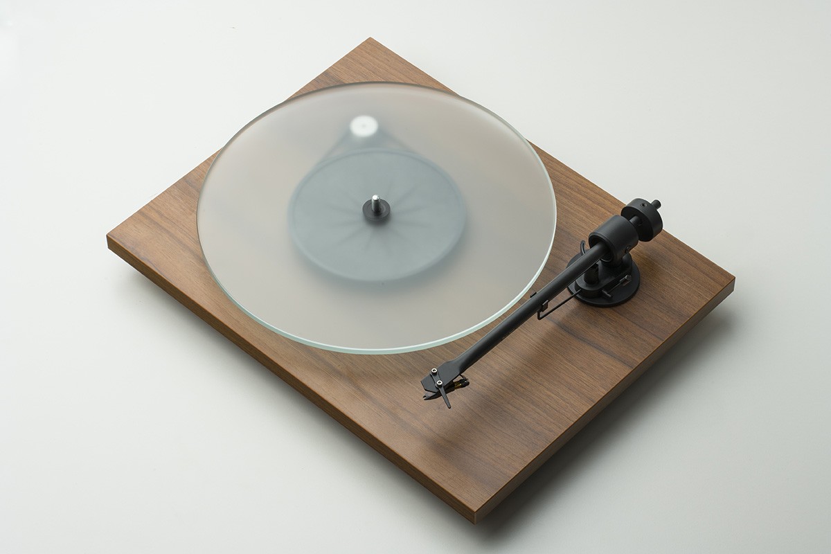 Walnut turntable seen from a three-quarter angle