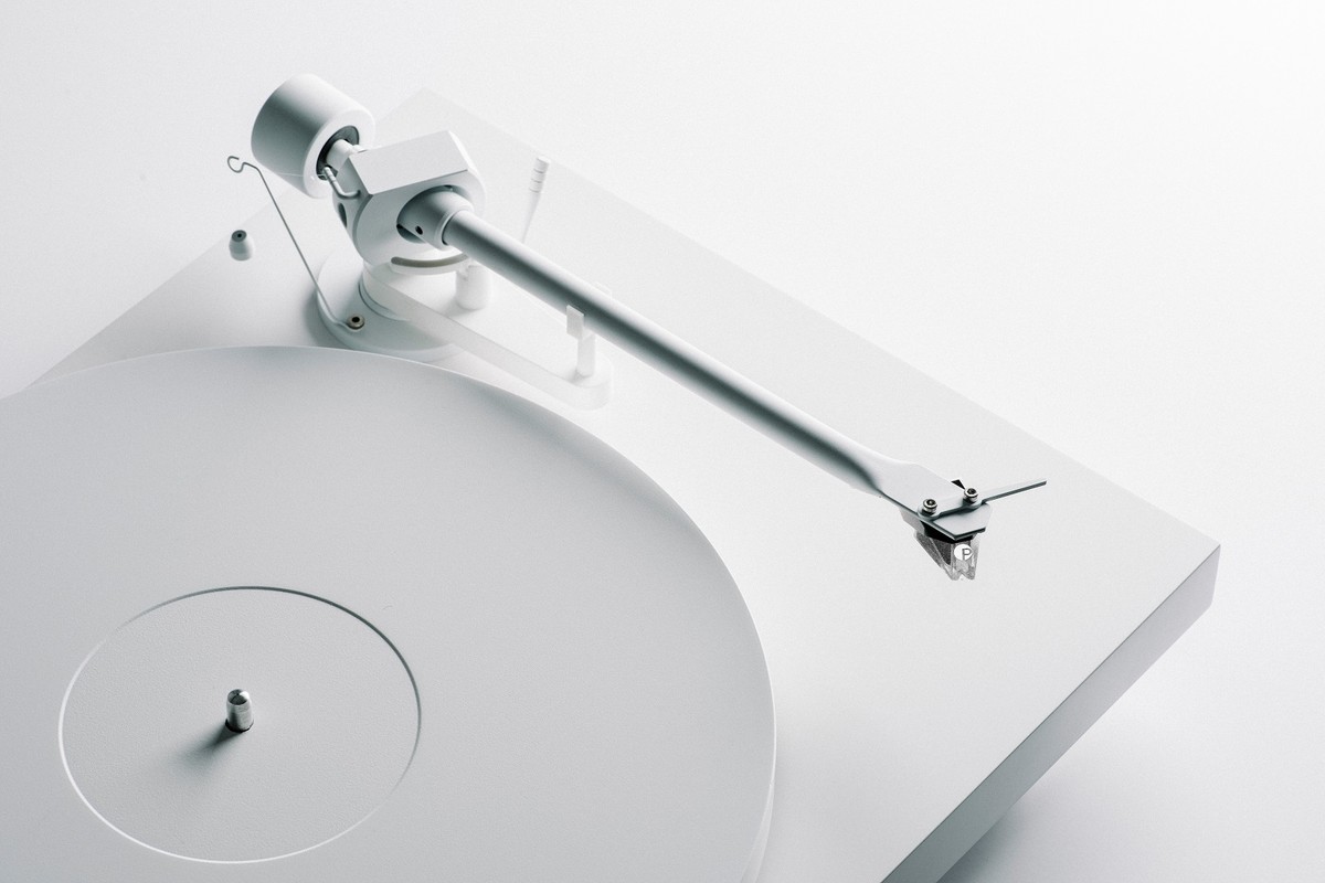 White arm seen from above over the platter