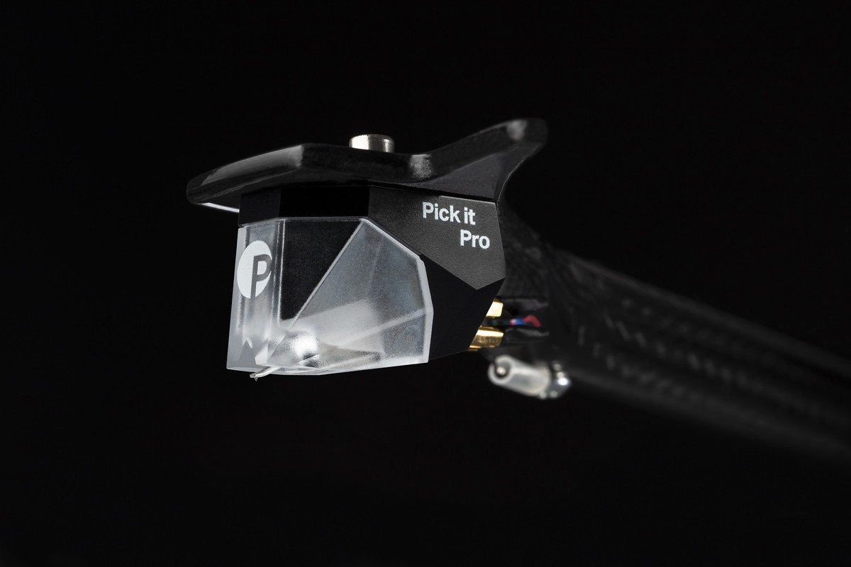 Transparent cartridge on a carbon tonearm, side view