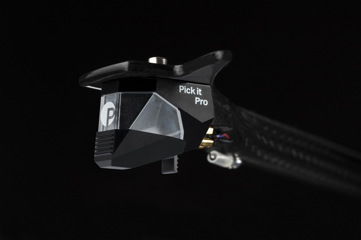Cartridge with its stylus guard, mounted on the tonearm