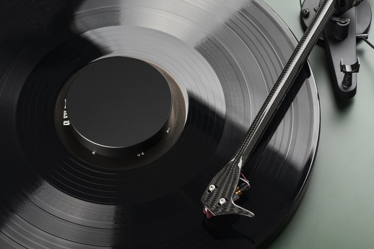 Black puck in the centre of a playing record