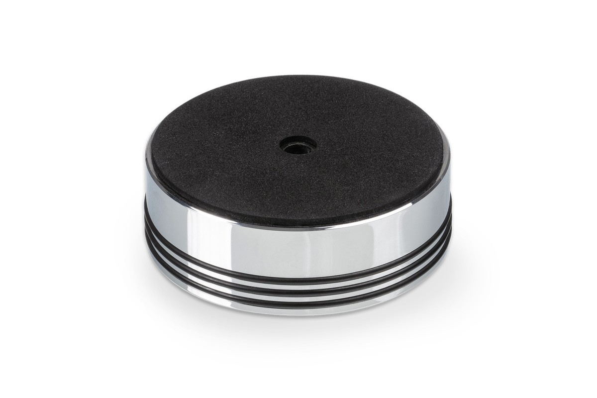 Chrome puck seen from below with its felt pad