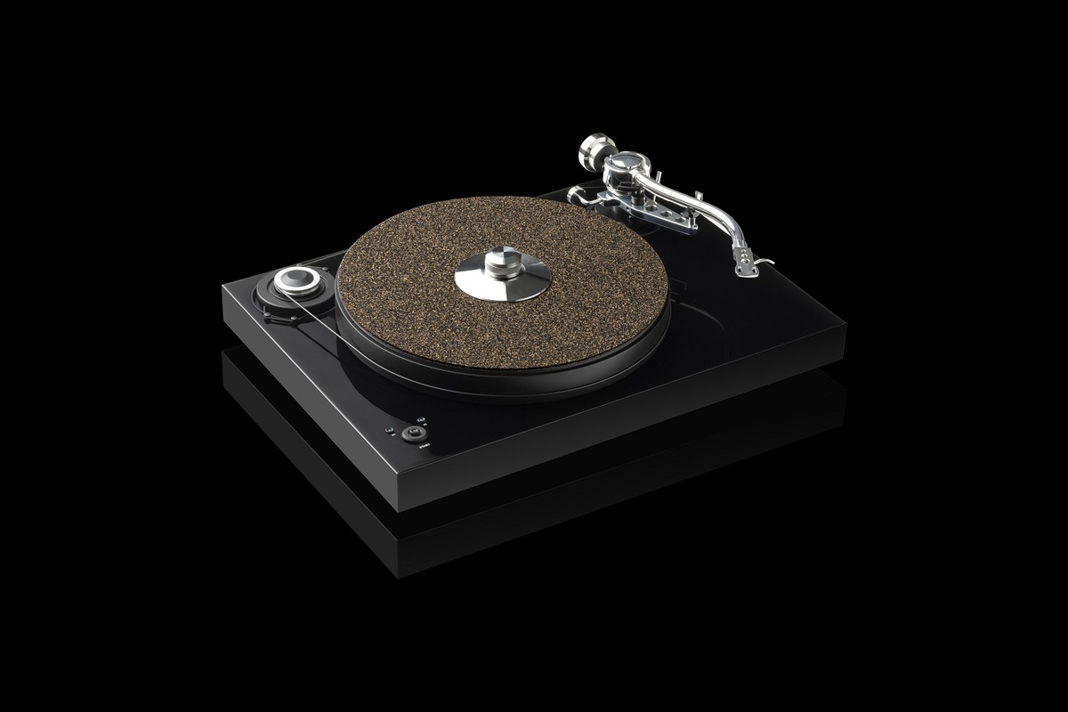 Black turntable fitted with a cork mat on a black background