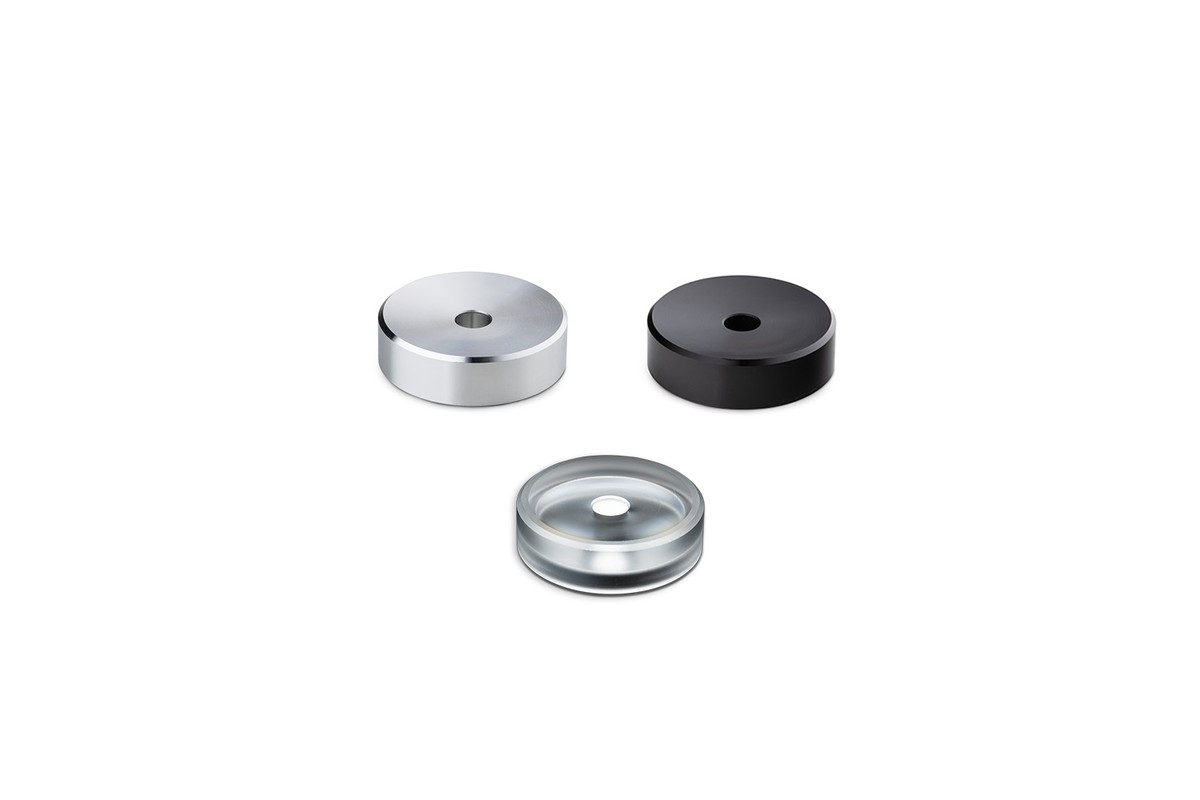 The three versions of the adapter: silver, black and acrylic