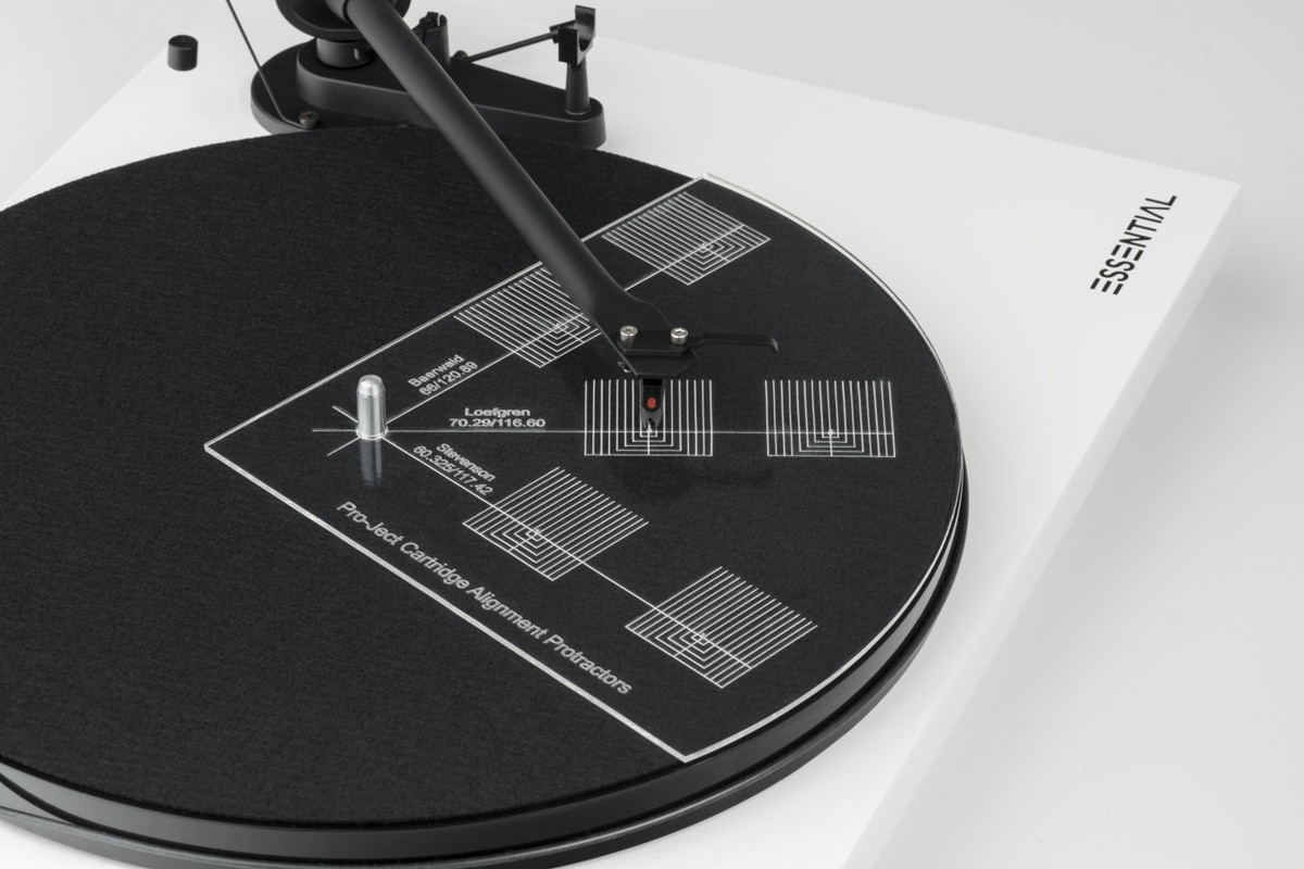 Clear template placed on the platter of a white turntable