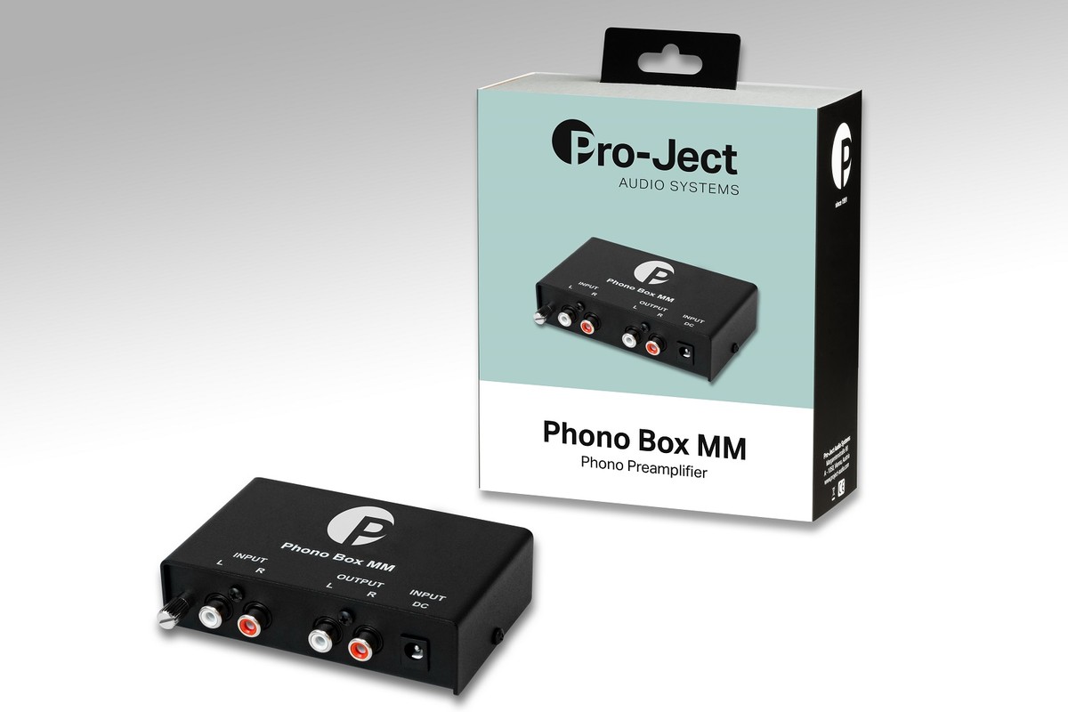 Black preamplifier in front of its retail box