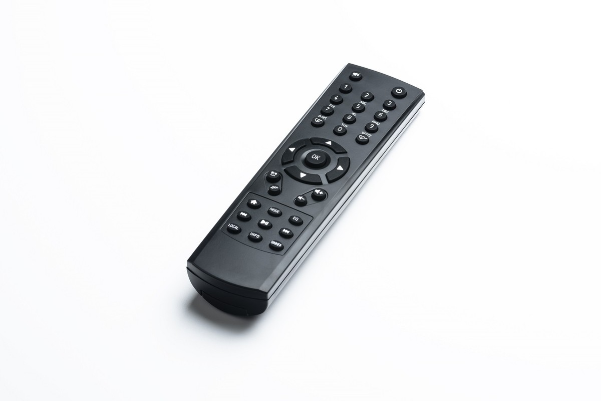 Black remote control on a white background