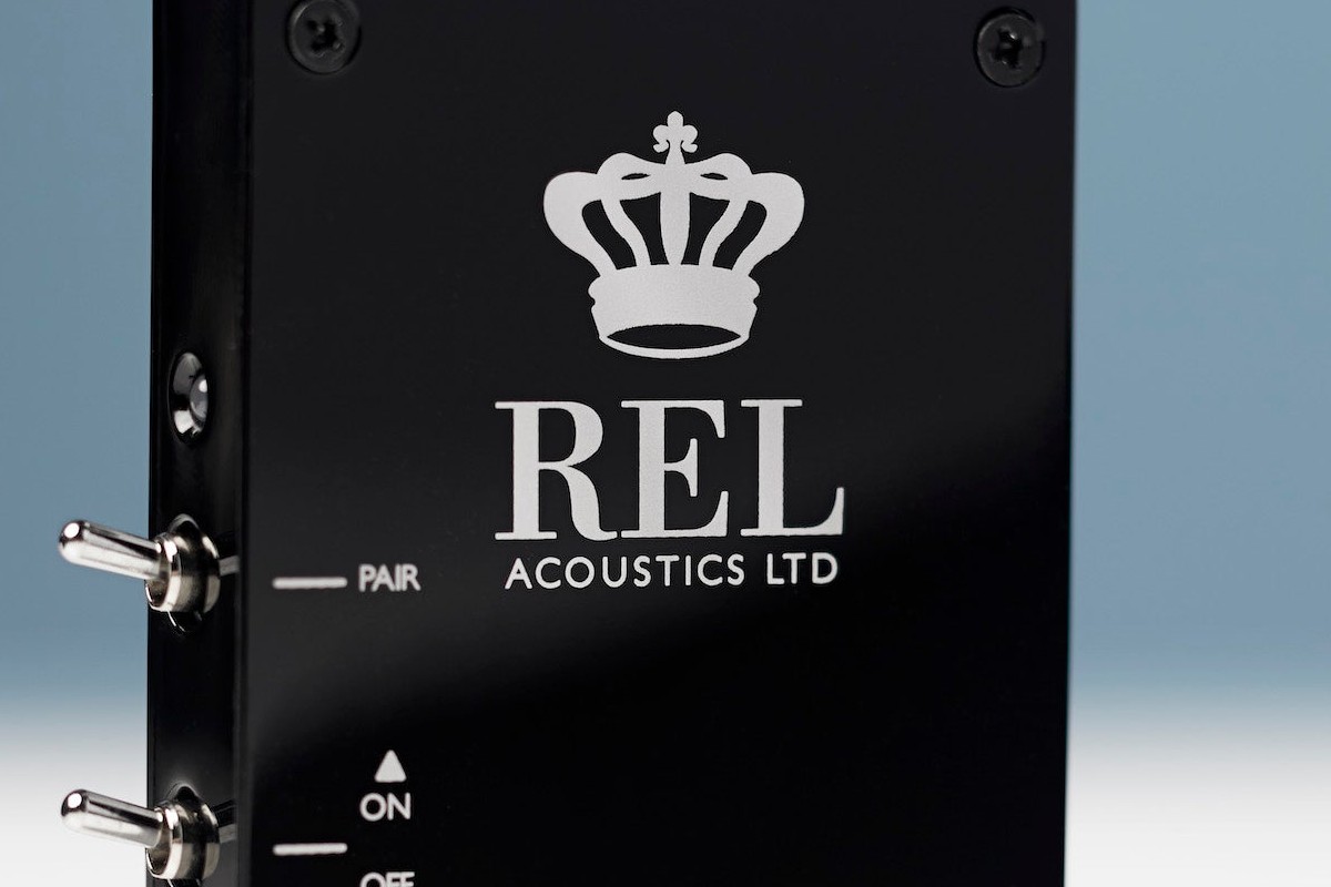 Gloss black receiver with the brand crown and logo, pairing switch