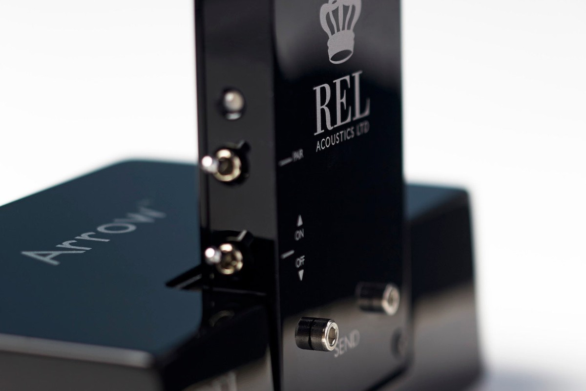 Receiver standing behind the transmitter engraved with its name, close up