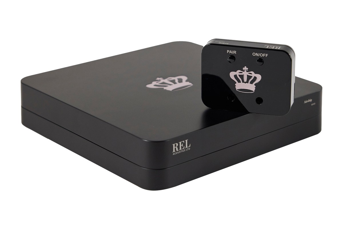 Flat black transmitter with the small crown-logo receiver on top