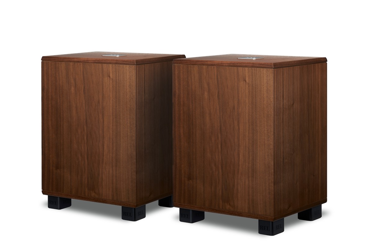 Two walnut subwoofers side by side, ready to run as a stereo pair