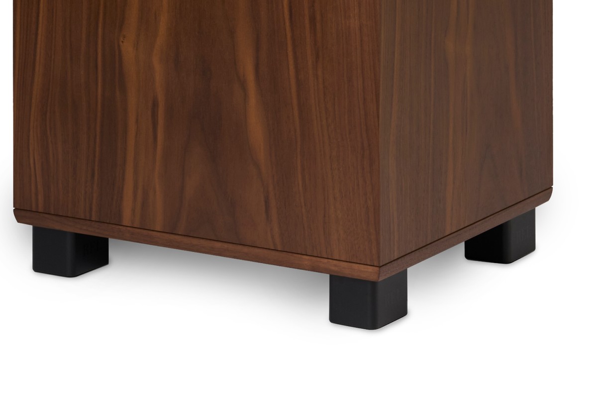 Lower part of the walnut cabinet standing on four black feet
